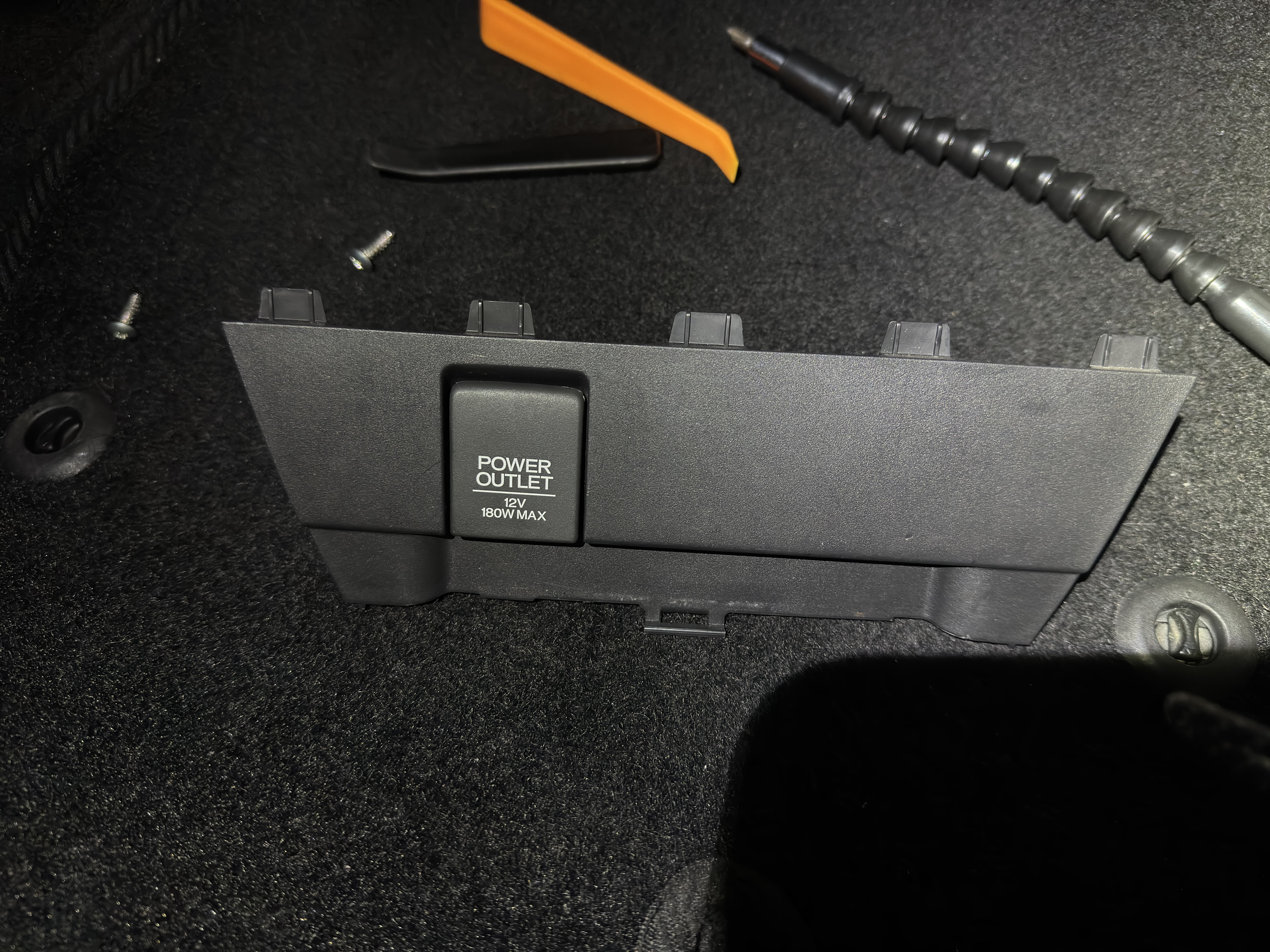 There are a few clips holding it in place at front side. Be careful not to
break them how I almost do.