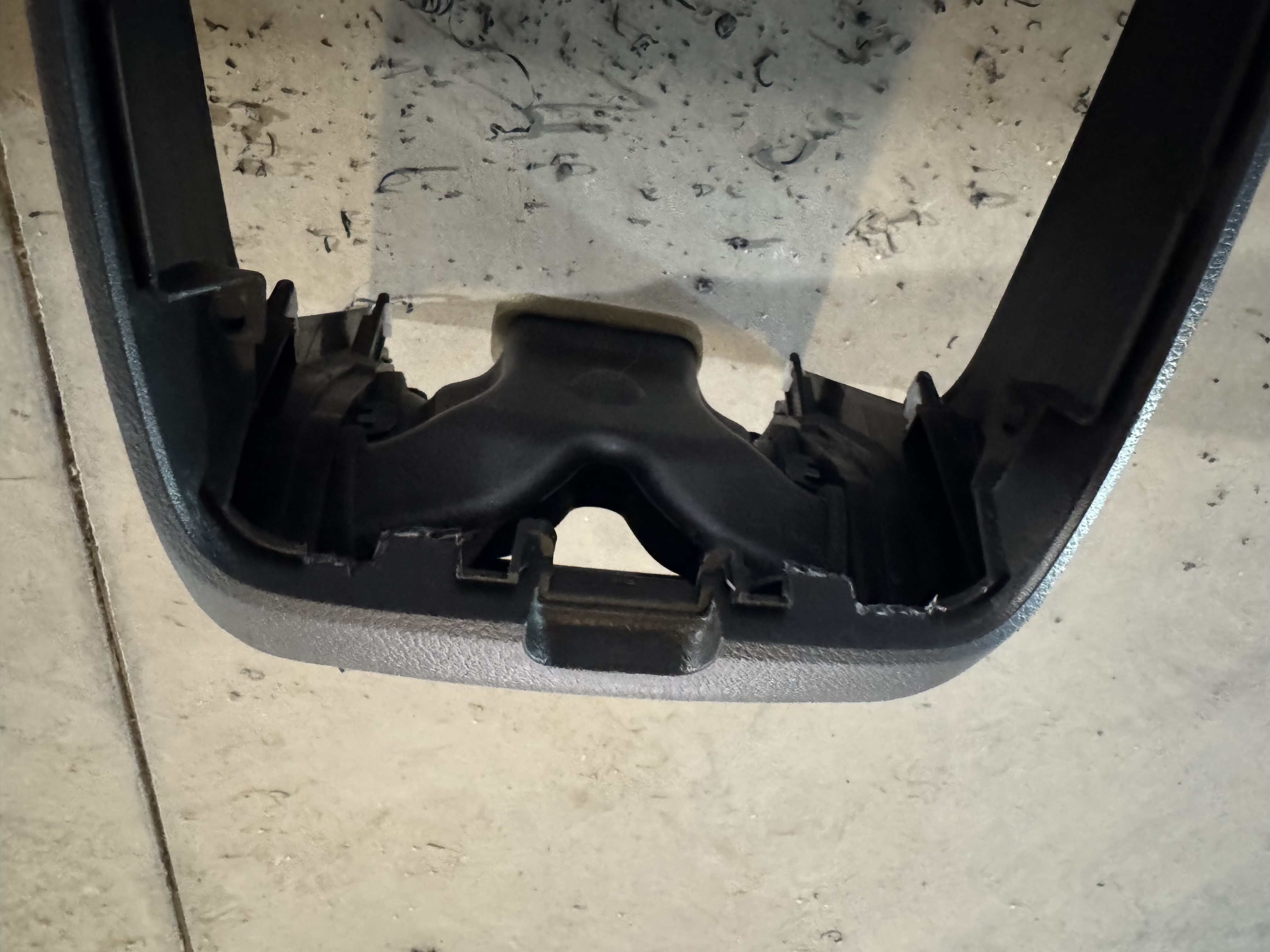 The chargers I prepared for installation didn’t quite fit, or rather, the nuts
that secure them didn’t fit, so I had to remove some plastic from the inside
around the intended installation site—on either side of the standard cigarette
lighter socket.